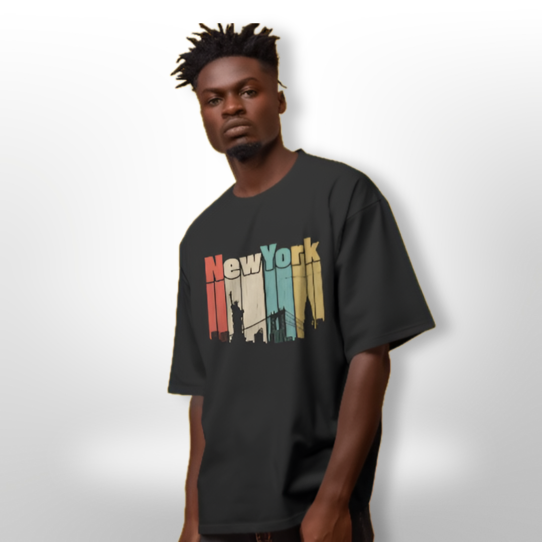 Model wearing the New York design oversized T-shirt while exploring urban streets, paired with trendy leather pants.