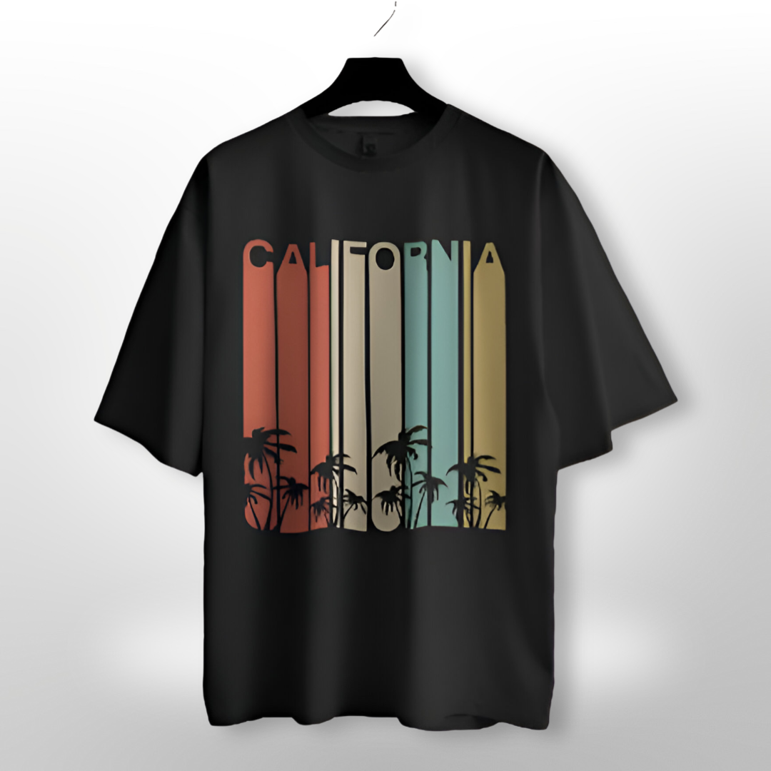 Unisex oversized T-shirt featuring a bold 'CALIFORNIA' design with surf and sun graphic on a sunny yellow background.