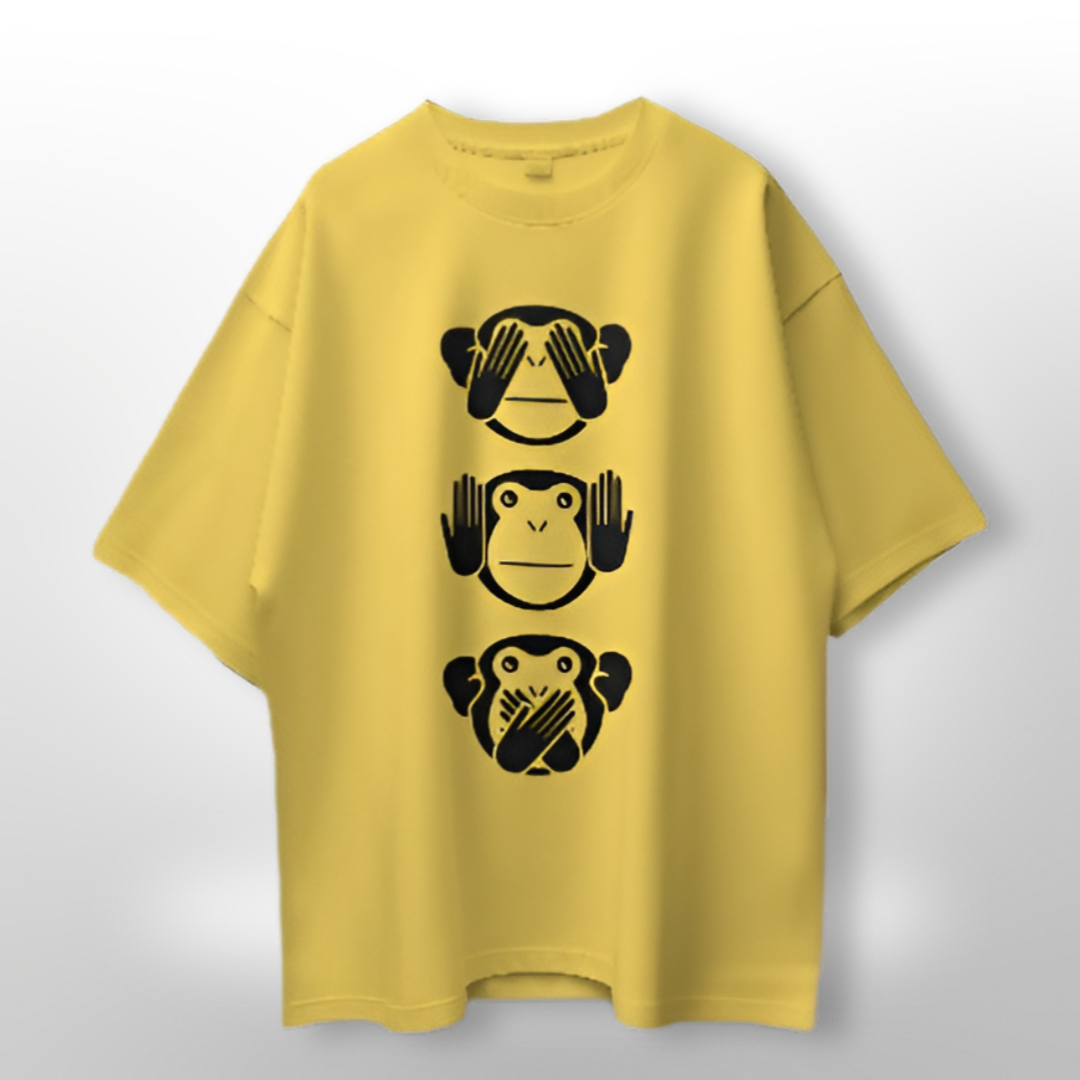 Unisex oversized T-shirt featuring the classic 'See No Evil, Hear No Evil, Speak No Evil' three monkeys design on a beige background.
