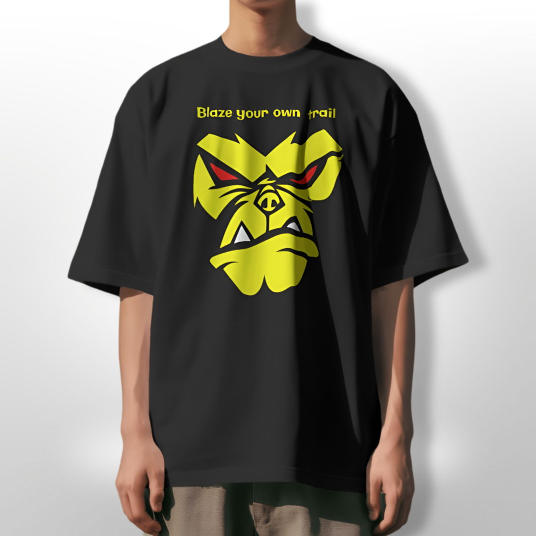 Model wearing charcoal grey Angry Monkey oversized T-shirt, styled with casual jeans.