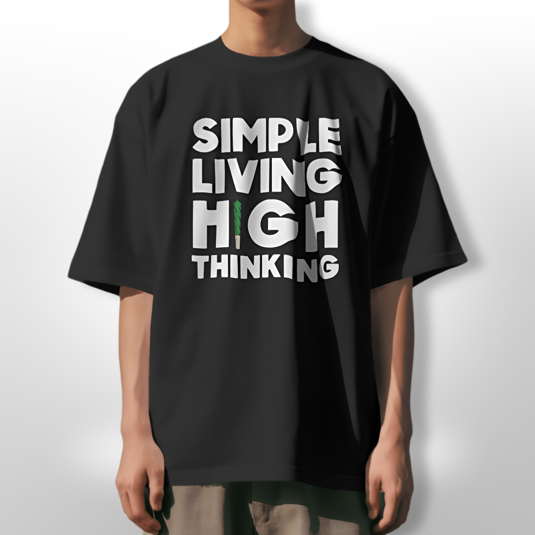 Model wearing white 'Simple Living High Thinking' oversized T-shirt, paired with relaxed denim.