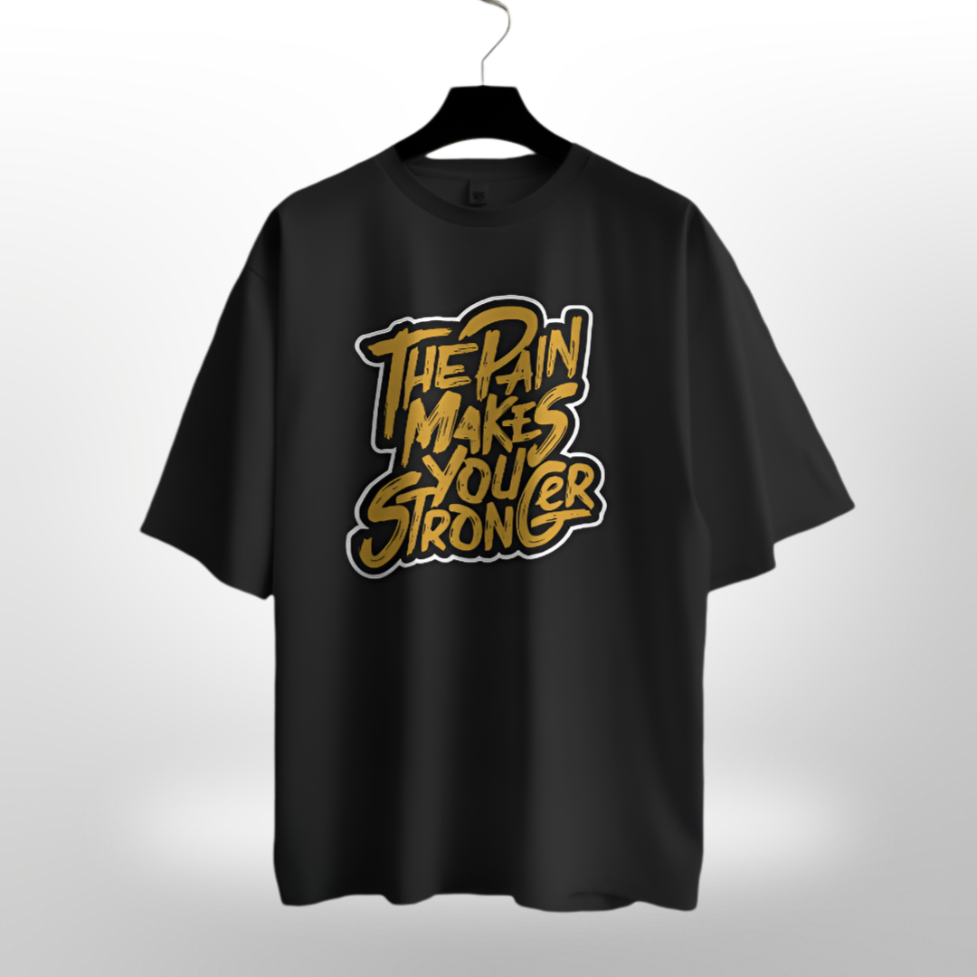 Unisex 'The Pain Makes You Stronger' motivational quote on a sleek black oversized T-shirt.
