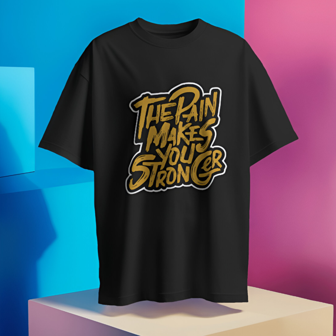 Fitness enthusiast wearing 'The Pain Makes You Stronger' T-shirt while jogging on a city trail.