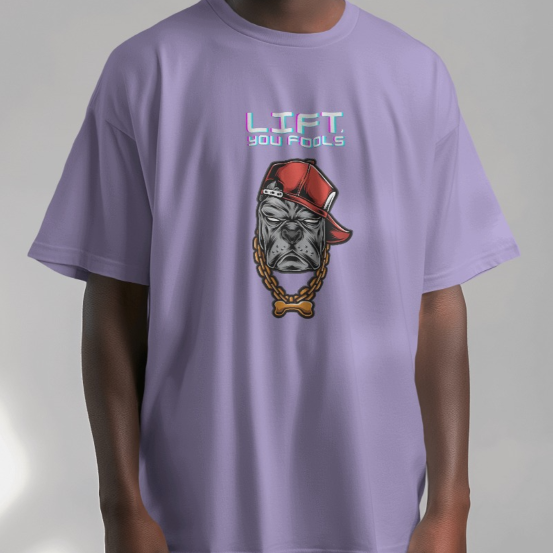 Fitness enthusiast modeling the 'LIFT, You Fools' oversized T-shirt during a workout session.