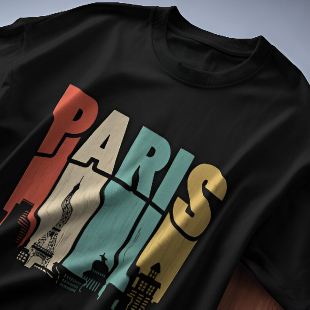 Close-up view of intricate PARIS design on oversized T-shirt, highlighting premium stitching.