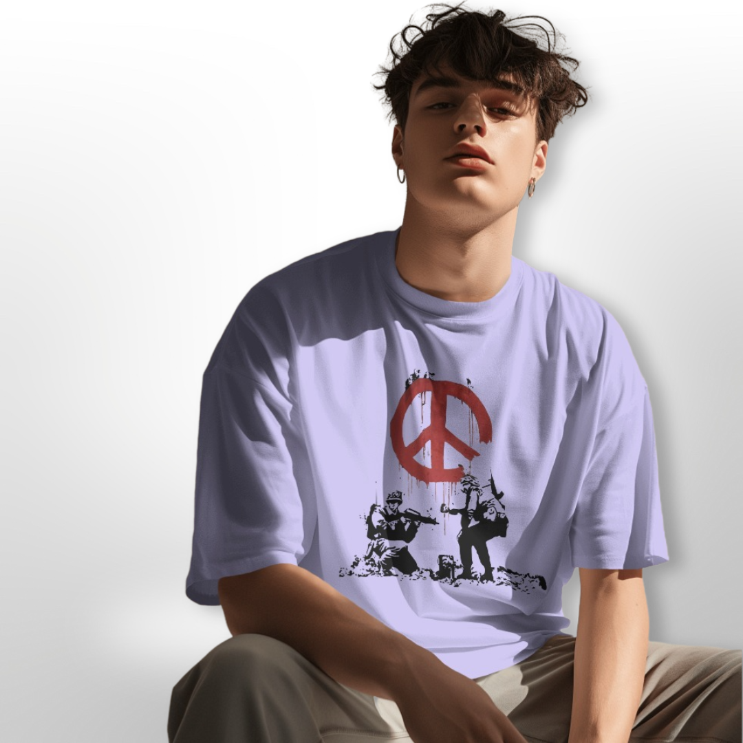 Model wearing 'Peace in War' oversized T-shirt, styled with cargo pants for a rugged look.