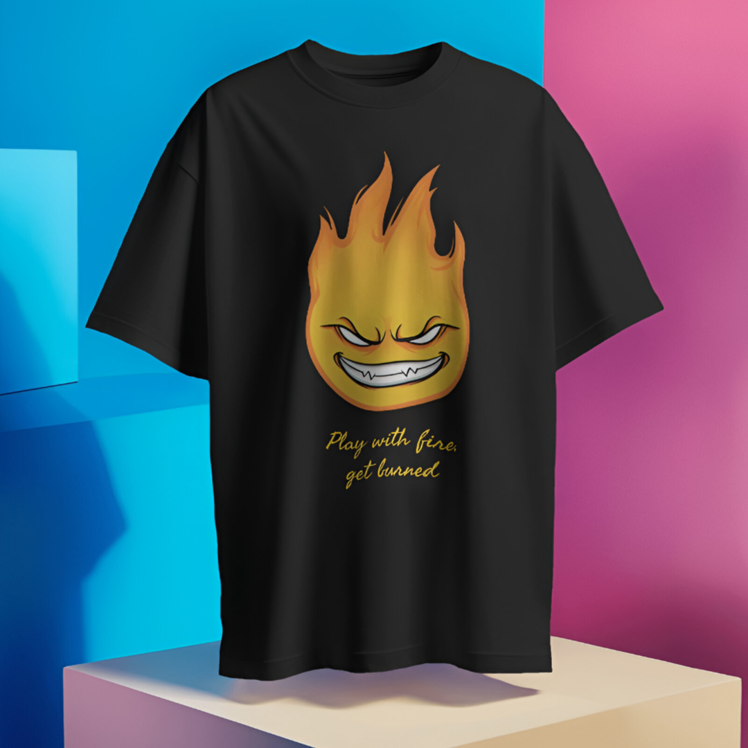 Individual sporting the 'Play with Fire, Get Burned' T-shirt while attending a nighttime outdoor event.