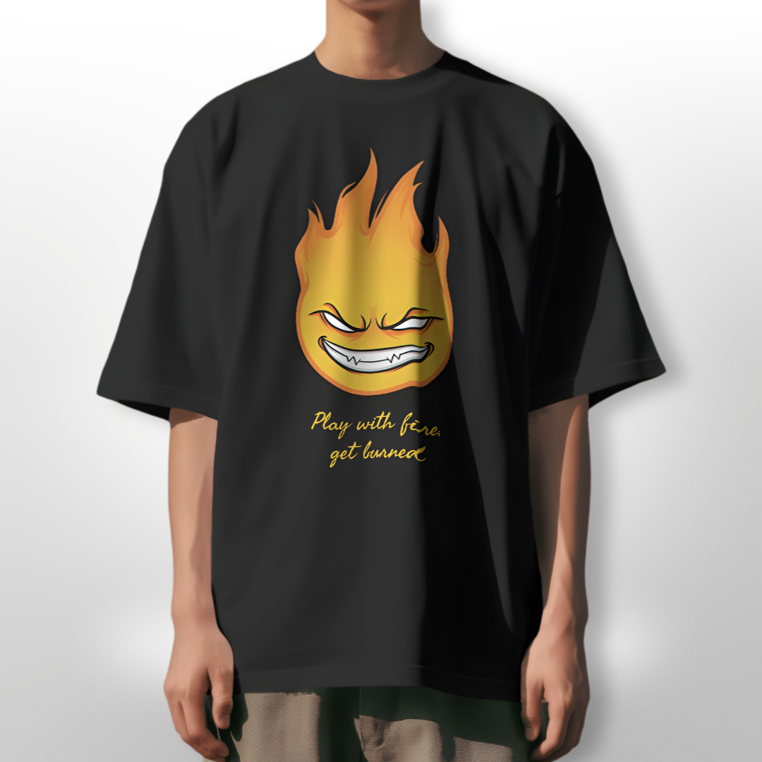 Model wearing the 'Play with Fire, Get Burned' oversized T-shirt at a casual outdoor gathering.
