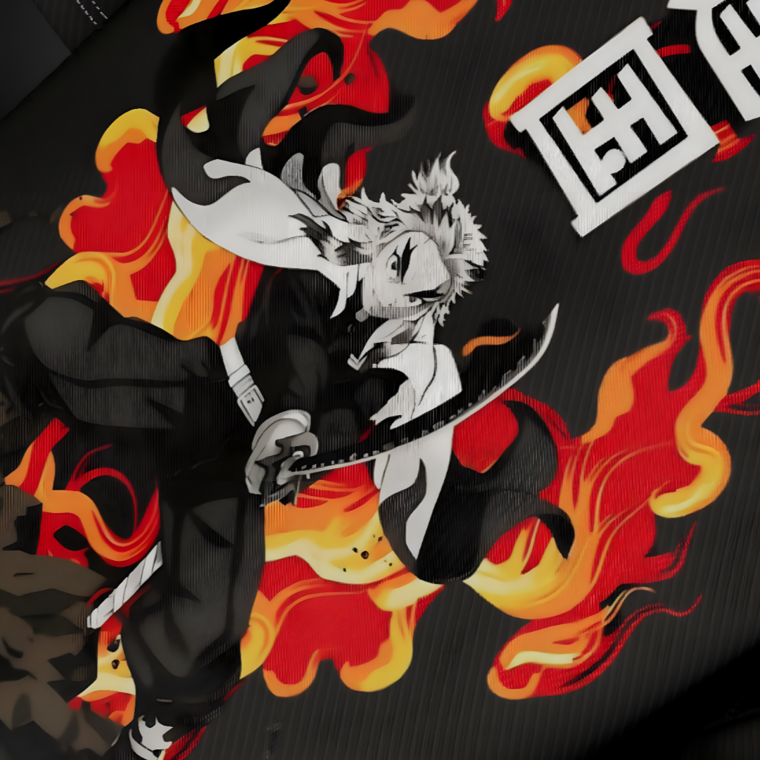 Detailed view of Rengoku's fierce expression and 'Set Heart to Blaze' text on vibrant red T-shirt.