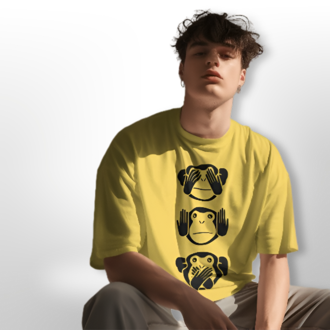 Model wearing the Three Monkey designed oversized T-shirt, styled with casual cargo pants for a relaxed look.