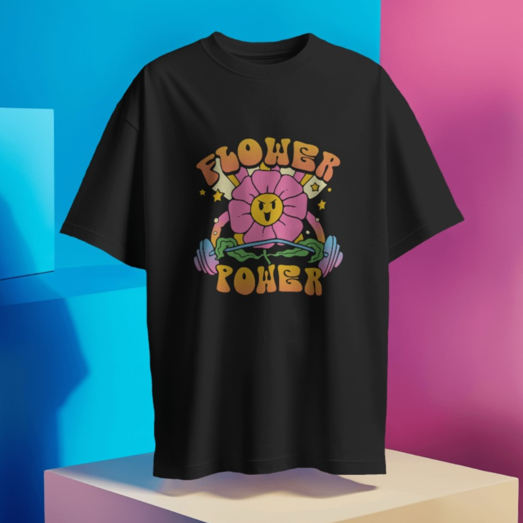 Detailed view of vibrant floral design and 'Flower Power' text on oversized gym T-shirt.