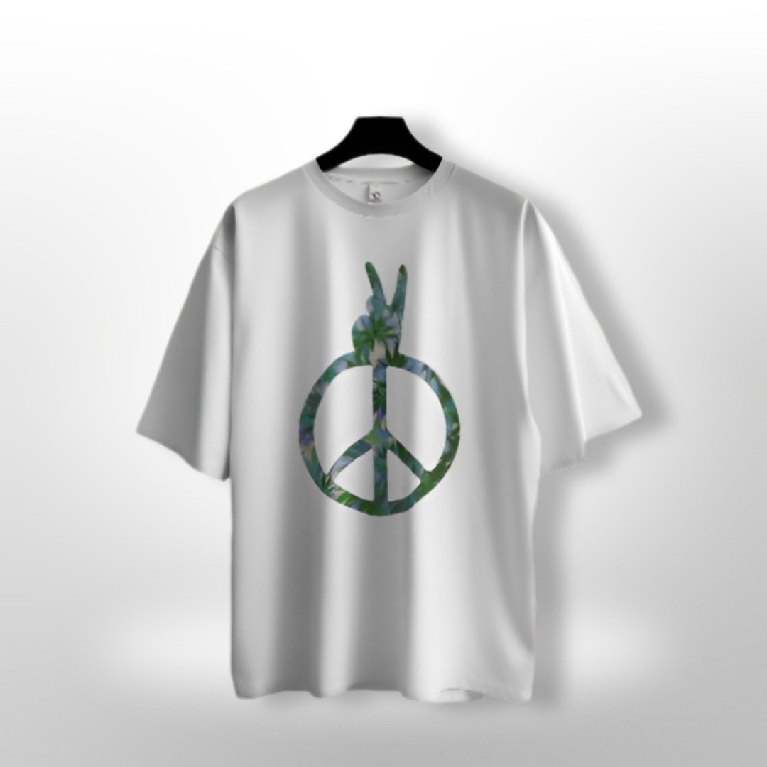 Detailed view of the 'Green Piece' environmental message with stylized earth and leaf graphics on a green T-shirt.